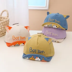 Detailed display of four colorful baby baseball caps with cute cat ears and soft brims