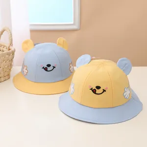 Kids smile face bucket hat with cute 3D ears in blue and yellow contrast colors