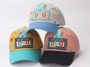 Detailed view of kids baseball caps featuring 3D cartoon dinosaur patches and fun prints