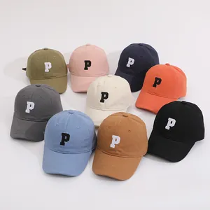 Detailed assortment of colorful kids' cotton baseball caps featuring embroidered P logo