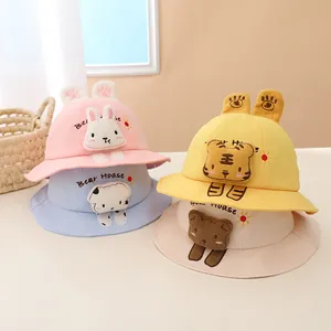 Close-up of colorful children's sun hats featuring 3D animal ears and bear embroidery