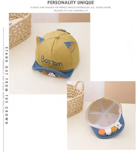 Detail of baby baseball cap with cute cat ears, mesh lining, and embroidered letters