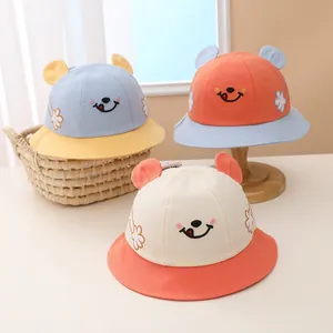 Adorable kids bucket hats featuring cute smiley face embroidery and decorative 3D ears