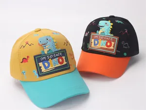 Detail of kids baseball caps featuring 3D dinosaur rubber patch and cartoon prints