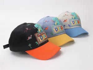 Close-up of adjustable children's dinosaur caps with cartoon embroidery and prints