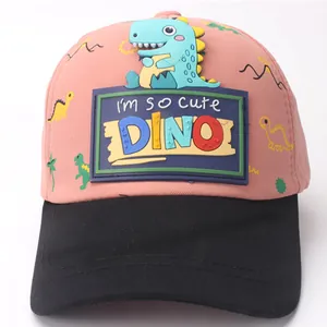 Close-up of pink and black kids baseball cap with 3D cute cyan dinosaur patch and DINO logo