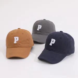 Child baseball cap with embroidered letter P in brown, dark grey, and navy colors
