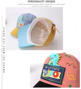 Close-up of kids dinosaur baseball cap featuring 3D silicone patch and cartoon prints