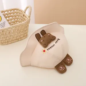 Detail of beige cotton baby sun hat featuring 3D plush bear ears and cute paw ear flaps