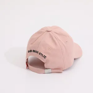 Rear view of pink cotton kids baseball cap with silver metal buckle and baby embroidery