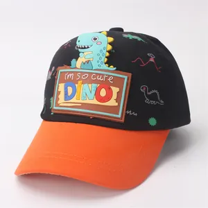 Close-up of kids dinosaur baseball cap with 3D rubber patch and orange brim detail