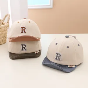 Soft-brimmed baby baseball caps featuring letter R embroidery in multiple colors