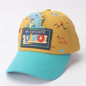 Detail of yellow and blue kids baseball cap with 3D cartoon dinosaur and cute text