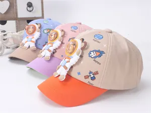 Detailed view of three-color kids baseball caps with 3D astronaut bear patches