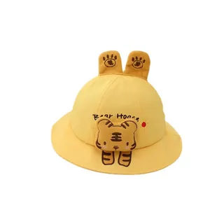 Cute yellow cotton toddler bucket hat with cartoon tiger patch and plush ear details