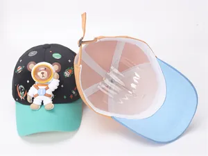Detail view of children's space bear baseball caps showing inner structure and 3D bear