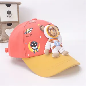 Detail view of kids baseball cap with 3D astronaut bear and cosmic planet prints