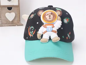 Detail of 3D astronaut bear motif and space prints on children's baseball cap