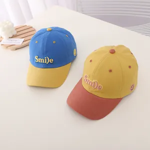Kids color block baseball caps with Smile embroidery in royal blue and yellow
