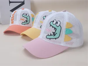 Detailed view of children mesh baseball caps with embroidered cartoon dinosaurs