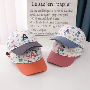 Detail of four colorful kids baseball caps with car prints and 3D letter A embroidery