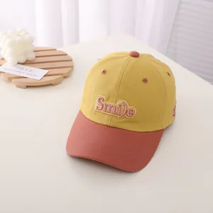 Close-up of children's baseball cap with Smile 3D embroidery and contrast color design