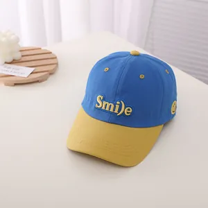 Detailed embroidery of yellow Smile text on blue and yellow contrast baseball cap