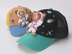Detail of 3D astronaut bear motif and space prints on breathable mesh baseball caps