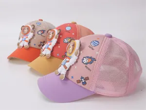 Close-up of three mesh baseball caps with 3D astronaut bears and space prints