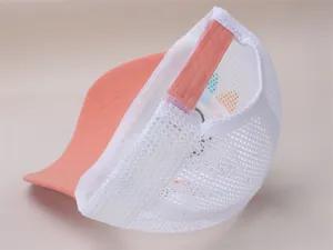 Rear view of breathable mesh kids trucker hat with adjustable strap and orange peak