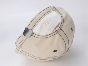 Detail view of cotton baseball cap back with adjustable metal buckle and black stitching