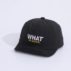 Detail of black quick-dry kids baseball cap featuring WHAT ON HOLIDAY embroidery