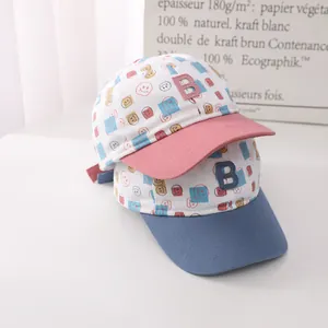 Close-up of kids baseball cap with B-letter patch and colorful smiley face prints