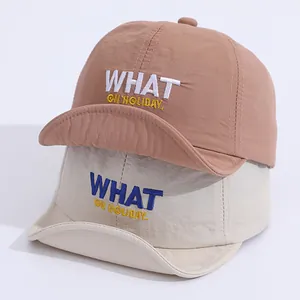 Kids quick dry soft brim baseball cap with WHAT letter embroidery in tan and beige