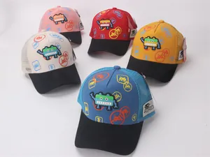 Flat lay of colorful children mesh baseball caps featuring 3D robot patches and Kuku label