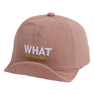 Kids quick dry soft brim baseball cap in clay pink with WHAT ON HOLIDAY embroidery