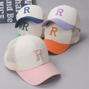 Close-up of breathable mesh back and 3D letter R embroidery on colorful kids baseball caps