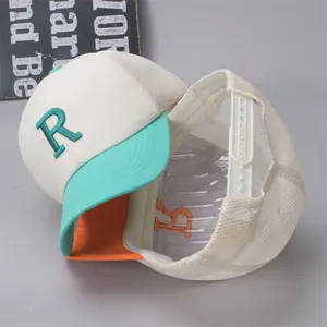 Detail of kids mesh baseball cap with embroidered letter R and contrast color brim