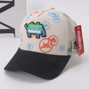 Detail of kids trucker hat featuring 3D pixel robot patch and breathable white mesh back