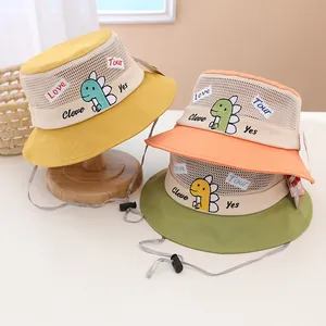 Breathable mesh sun hat for kids featuring cute cartoon dinosaur patches and wind cord