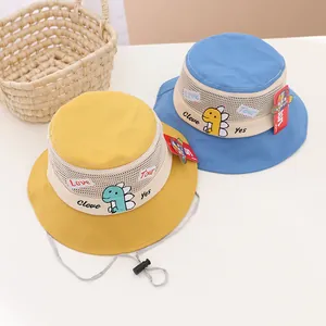 Detail of mesh panel and dinosaur embroidery on children's breathable sun hat