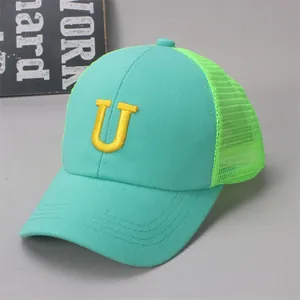 Detail of kids mesh baseball cap in mint green and neon green with letter U embroidery