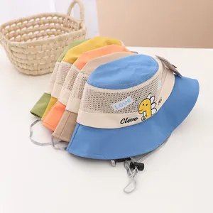 Detail of kids mesh sun hats with dinosaur patches and adjustable windproof ropes