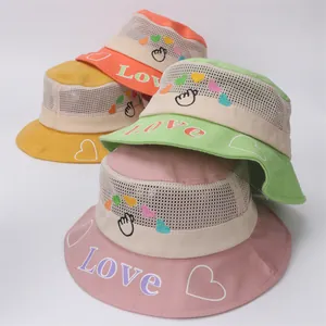 Detail of four colorful breathable mesh sun hats for toddlers with Love embroidery