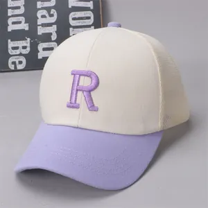 Close-up of children's mesh baseball cap with R embroidery and purple brim detail