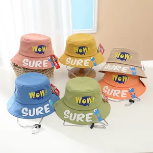 Detail of colorful kids bucket hats with WOW lettering and adjustable chin straps