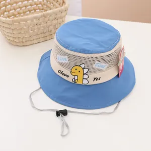 Detail of baby sun hat featuring blue breathable mesh fabric and dinosaur embroidery