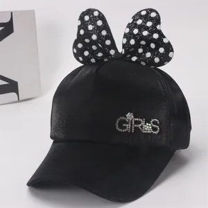 Casquette de baseball noire pour filles avec un grand nœud à pois et lettrage GIRLS en cristal