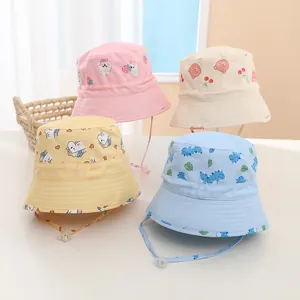 Detail view of four cotton toddler bucket hats in pink, beige, yellow and blue colors