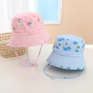 Detail view of cotton bucket hats for kids with adjustable windproof straps and cartoon prints